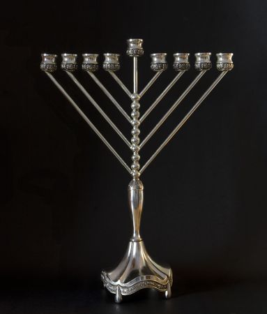 Traditional Hanukkah menorah on a black backgroundの写真素材