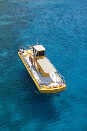The south of Israel Eilat city a yellow boat in the seaの写真素材