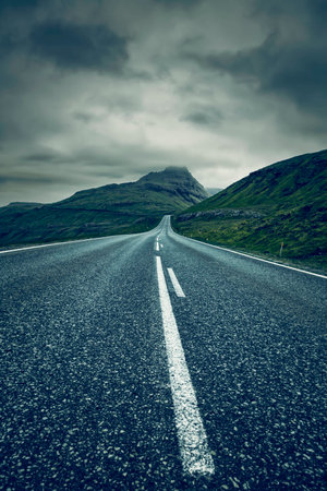 A long empty straight Road, Faroe Islandsの写真素材