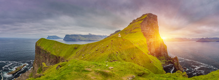 Shot Of Beautiful Panoramic Scene, Sunrise Over Kalsoy Island and Kallur lighthouse, Faroe Islandsの写真素材