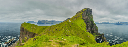 Shot Of Beautiful Panoramic Scene, Kalsoy Island and Kallur lighthouse, Faroe Islandsの写真素材