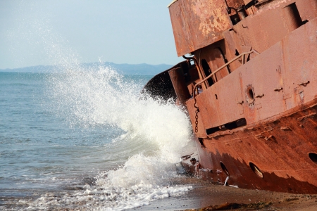 Old abandoned ship on the sea, beat wavesの写真素材