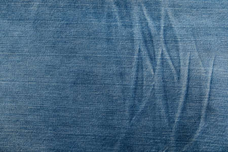 Blue Jeans Background Pattern. Classic denim Jeans Texture. Creases of jeans texture.の写真素材
