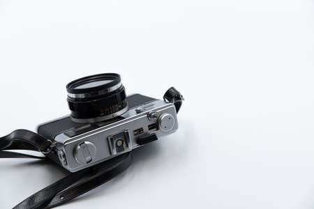 Isolated white background Beautiful vintage analog rangefinder film camera. 70's Decade film camera....