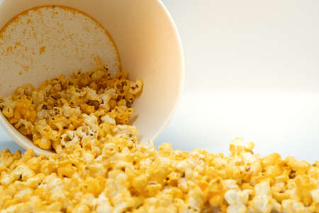 Selective focus popcorn was poured out of the bucket.の写真素材