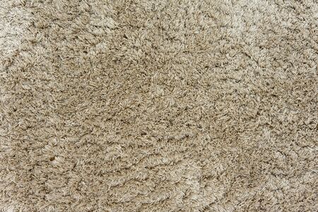Texture of a beige carpet