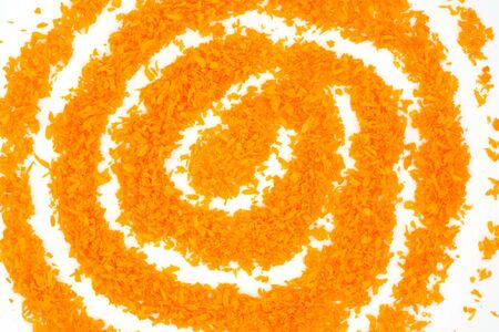Sunny symbol made of orange coconut flakesの写真素材
