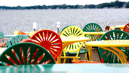 Colorful table and chairs on the beach. Selective focus.