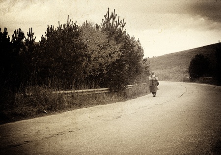 retro picture walk women in country roadの写真素材