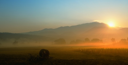 fall misty panorama in sunrise time の写真素材
