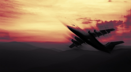 abstract sunset sky red colored with blured airplaneの写真素材