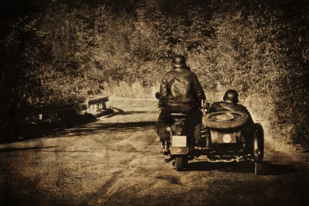 vintage moto biker in the roadの写真素材