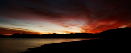 high contrast abstract red sunrise over the lakeの写真素材