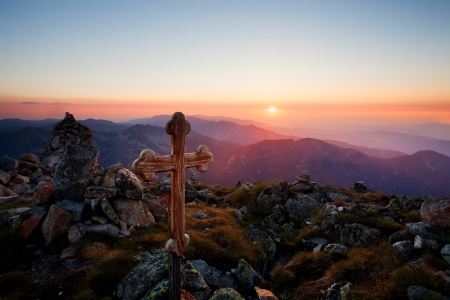 sunset over the holy wooden cross in high bulgarian mountain の写真素材