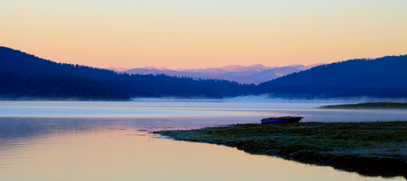 high mountain lake in morning sunrise panoramic landscapeの写真素材