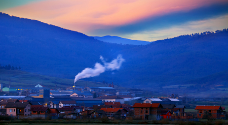 cold morning over the small mountain industrial townの写真素材