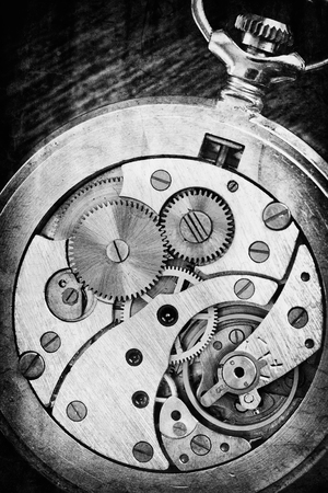 black and white vintage clock mechanism close-up- some noice added for stronger vintage effect