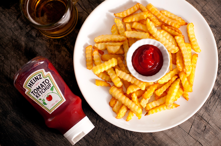 DORKOVO, BULGARIA - JANUARY 16, 2017: Close up on a single bottle of Heinz Tom and french fries over...