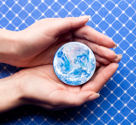 save planet concept with human hand holding small planet Earth- elements of this image furnished by NASAの写真素材