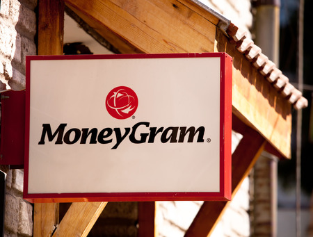 BANSKO, BULGARIA - MARCH 01, 2017: The logo of the brand "Moneygram" over the wooden backgroundのeditorial素材