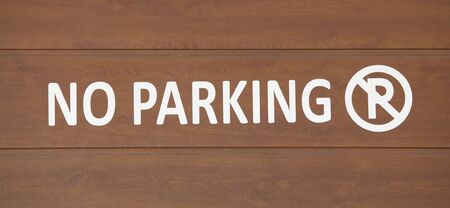 No Parking Sign over wooden surfaceの写真素材