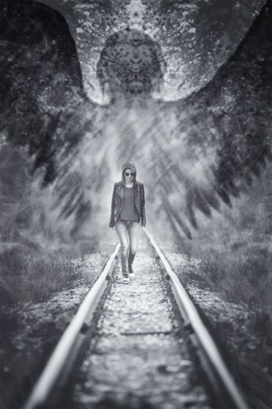 abstract background with angel or ghostly shadow above the young woman, danger save concept, black and white vertical art wallpaperの写真素材