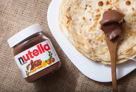 DORKOVO, BULGARIA - DECEMBER 12, 2017: Pancakes with nutella cream.Nutella introduced to the market in 1964 by Italian company Ferrero, Nutella is widely popular brand name of a sweetened hazelnut cocoa spreadのeditorial素材