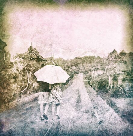 couple walking in rainy forest, abstract vintage background, some noise added for stronger vintage effectの写真素材