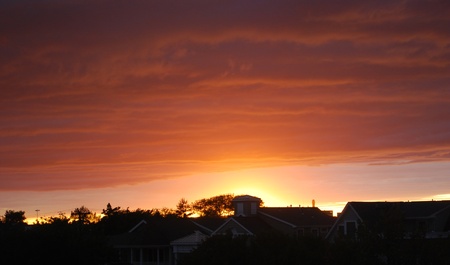 sunset over rooftopsの写真素材