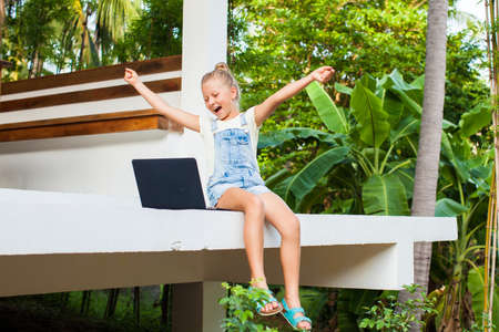 Nice review. Charming cheerful pre-teen girl doing a makeup brush review and broadcasting it live via her phone location Thailand. shooting date 26.06.2020のeditorial素材