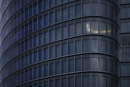 detail of skyscraper with one illuminated officeの写真素材