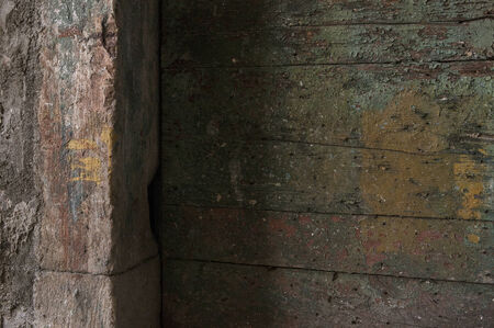 colored wall edge and decaying doorの写真素材