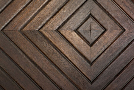 detail of door with concentric squares carved in wooden boardsの写真素材