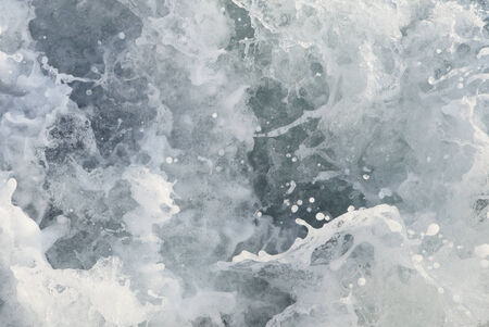 detail of seething sea water with many dropletsの写真素材