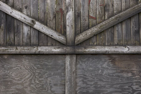 old gate made of rough wooden boardsの写真素材
