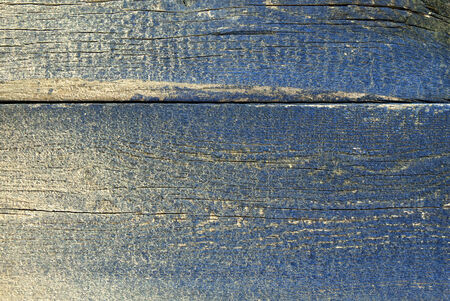 texture of rough wooden board with fading blue paintの写真素材
