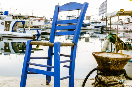 blue chair on the harbot in Thessaloniki の写真素材