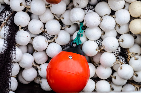 Fishing net with red and white balls の写真素材