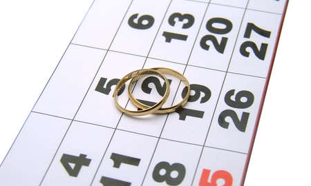 wedding rings on a calendar closeup