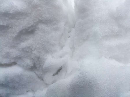 Abstract shapes and texture of frozen snow.の写真素材