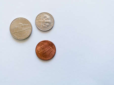 Metal money or coinage isolated on white background, currency or monet of United States of America, three coins.のeditorial素材