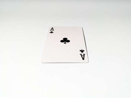 A close up view at one ace card with a club suit from a deck of playing cards. The concept of games, gambling, fun and free time.のeditorial素材