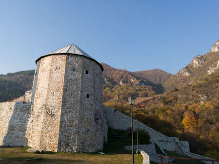 Historical landmark, the old fortress in Travnik with a tower at the foot of Mount Vlasic during a sunny autumn dayのeditorial素材