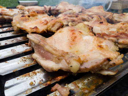 The concept of fast and delicious food. Frying meat on the grill.の写真素材