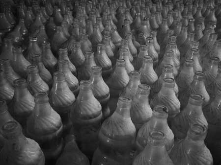 Pattern of open used dusty glass bottles, randomly arranged objects in spaceの写真素材