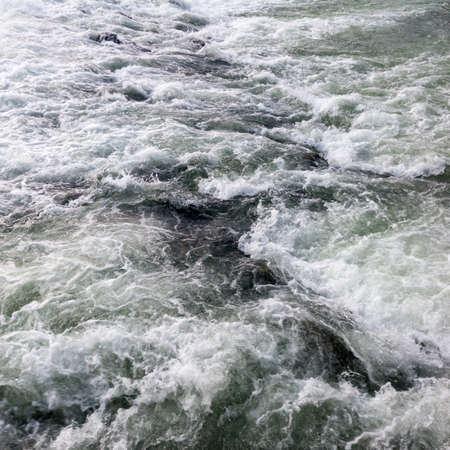 The sparkling turbulent water of the river Vrbas, rapid water movement, power of natureの写真素材