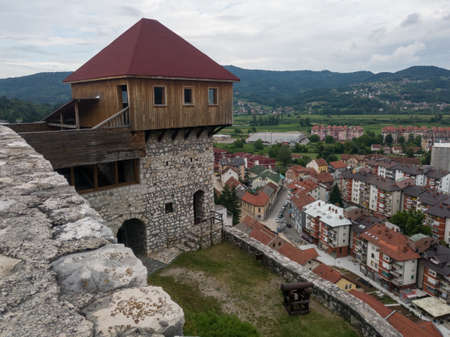 Tower on the medieval fortress Gradina above Doboj downtown during a cloudy summer dayのeditorial素材