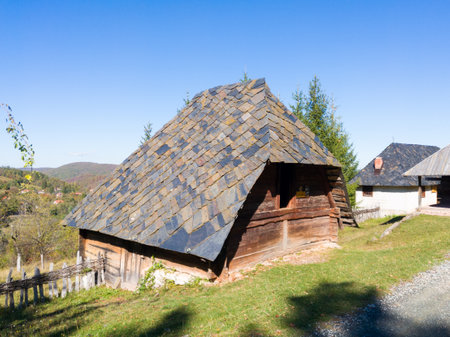 Open-air museum of an old village or ethno village with old wooden traditional buildings in the village of Sirogojno on the mountain Zlatibor in Serbiaのeditorial素材