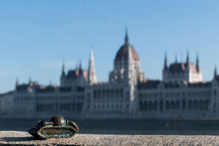 Sad little tank with parliament building in background, the hidden mini statue of Budapest, Hungaryのeditorial素材