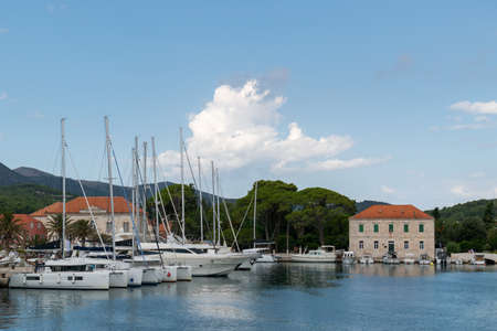 The town of Jelsa and the port with sailing ships on the island of Hvar in Croatia